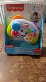 Fisher-Price Laugh & Learn Game & Learn Controller, UK English Version, musical toy with lights and learning content for baby and toddler ages 6-36 months, FWG12