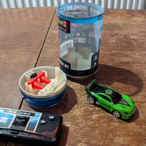 Revell Control 23560 Mini Remote Control Car Racing Car Green, With 40 MHz Control, In a Can Container, Includes Traffic Cones, 8cm in length